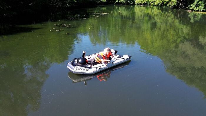 Drone shot of an active monitoring campaign: inflatable with the buoy in tow.